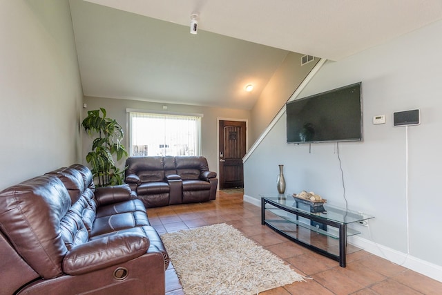 6335 Danshire Ct, Houston, TX 77049 - living room featuring vaulted ceiling and light tile patterned floors