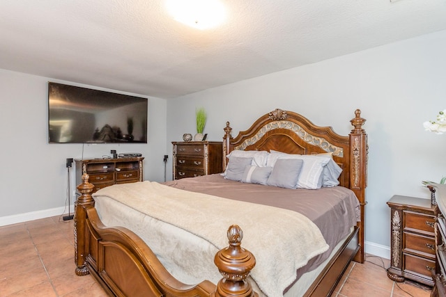 6335 Danshire Ct, Houston, TX 77049 - bedroom with light tile patterned flooring and a textured ceiling