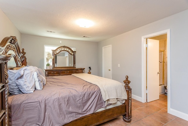 6335 Danshire Ct, Houston, TX 77049 - bedroom featuring light tile patterned flooring and a textured ceiling