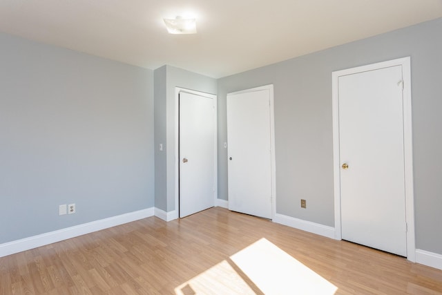 6335 Danshire Ct, Houston, TX 77049 - unfurnished bedroom with light wood finished floors and baseboards