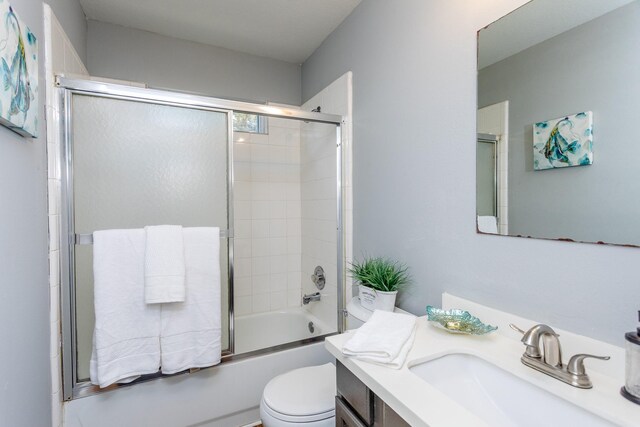 6335 Danshire Ct, Houston, TX 77049 - bathroom featuring vanity and bath / shower combo with glass door