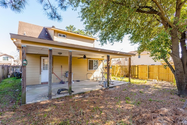 6335 Danshire Ct, Houston, TX 77049 - rear view of house featuring ceiling fan, a patio, and a fenced backyard