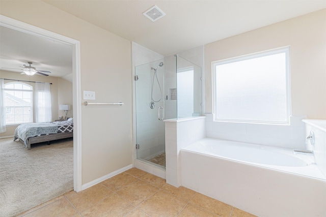 24802 Colonial Maple Dr, Katy, TX 77493 - full bathroom featuring a bath, connected bathroom, a stall shower, and tile patterned flooring