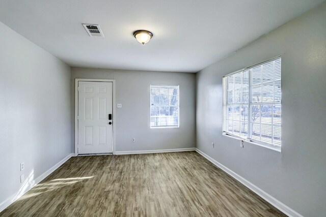 10201 Munn St, Houston, TX 77029 - foyer featuring wood finished floors and baseboards