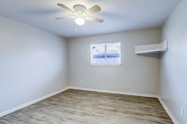 10201 Munn St, Houston, TX 77029 - spare room with wood finished floors and a ceiling fan