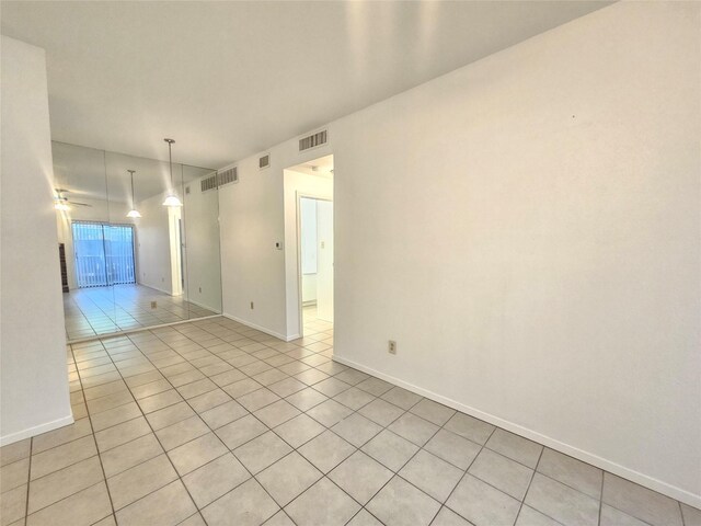 7950 N Stadium Dr Unit 191, Houston, TX 77030 - empty room featuring light tile patterned flooring and baseboards