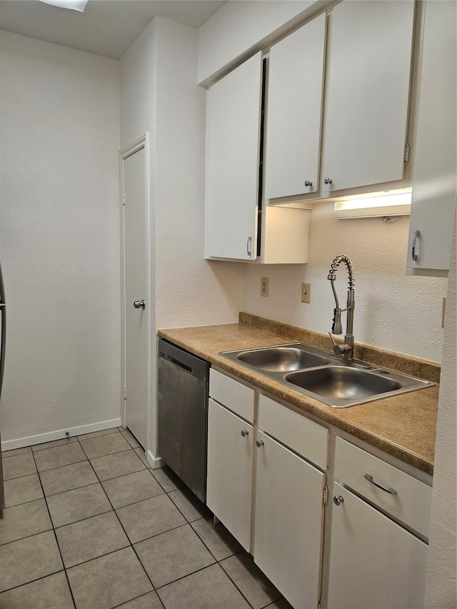 7950 N Stadium Dr Unit 191, Houston, TX 77030 - kitchen featuring stainless steel dishwasher, white cabinetry, and light tile patterned flooring