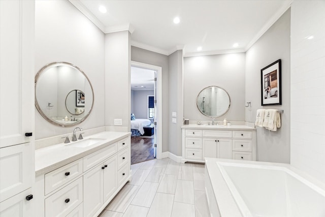 1712 Michigan St, Houston, TX 77006 - bathroom with two vanities, ornamental molding, a tub, ensuite bath, and recessed lighting
