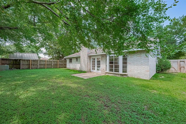 4330 Brookhead Trl, Houston, TX 77066 - back of property featuring french doors, brick siding, and a fenced backyard