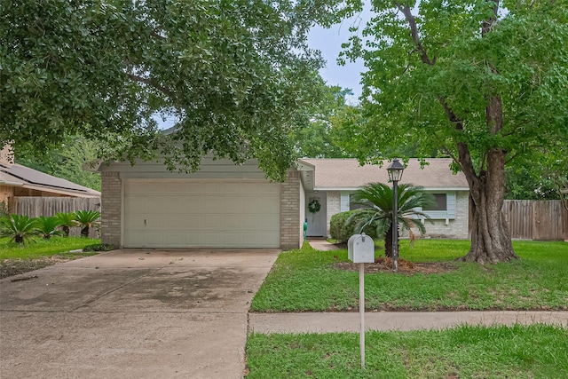 4330 Brookhead Trl, Houston, TX 77066 - obstructed view of property featuring brick siding, concrete driveway, and a garage