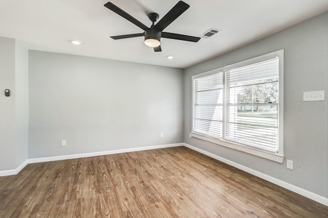 2003 Amelia St, Baytown, TX 77520 - spare room with a ceiling fan, wood finished floors, and recessed lighting