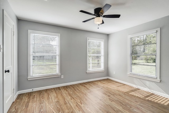 2003 Amelia St, Baytown, TX 77520 - spare room featuring plenty of natural light, wood finished floors, and a ceiling fan