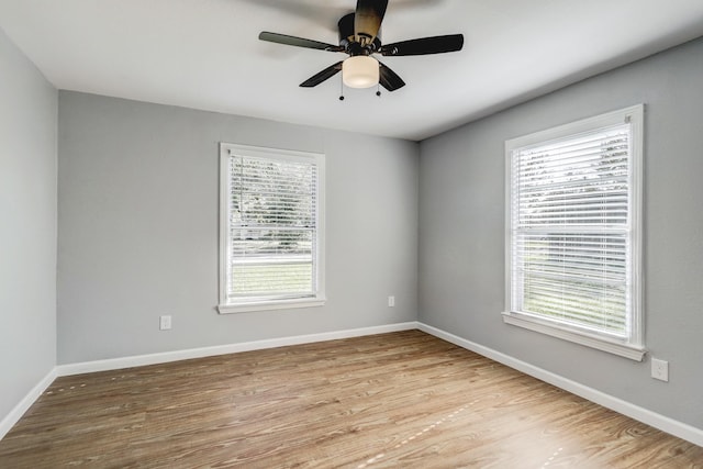 2003 Amelia St, Baytown, TX 77520 - unfurnished room with wood finished floors and a ceiling fan