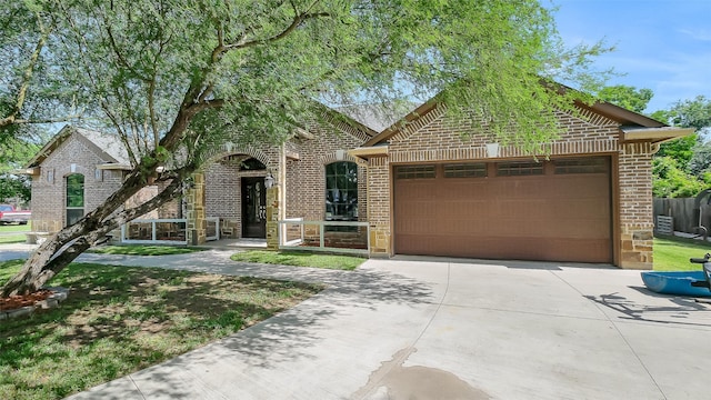 1804 Esther Dr, Houston, TX 77088 - view of front facade with brick siding, driveway, and a garage