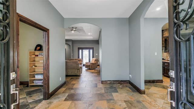 1804 Esther Dr, Houston, TX 77088 - entrance foyer with arched walkways, ceiling fan, light stone finish flooring, and recessed lighting
