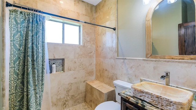 1804 Esther Dr, Houston, TX 77088 - full bath featuring a tile shower, vanity, and tile walls