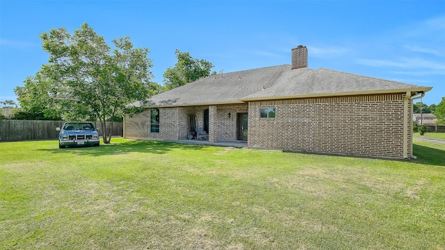 1804 Esther Dr, Houston, TX 77088 - back of property with brick siding and a chimney
