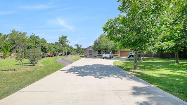 1804 Esther Dr, Houston, TX 77088 - view of property hidden behind natural elements with concrete driveway