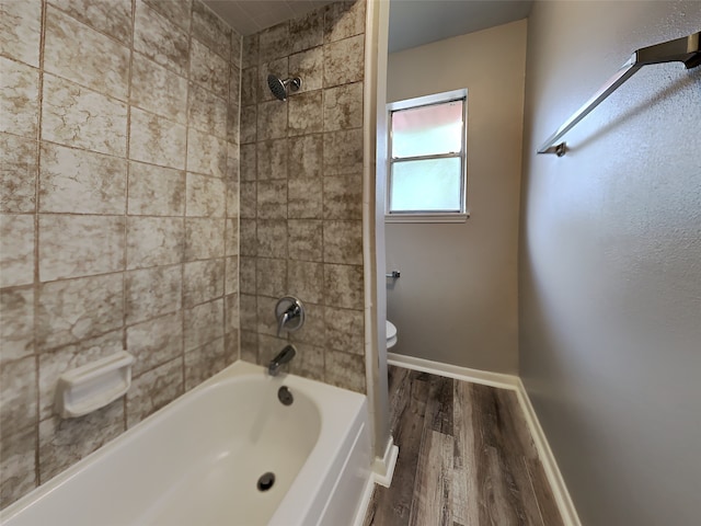 1402 Cherry Springs Ct, Missouri City, TX 77459 - bathroom featuring wood finished floors and shower / bath combination
