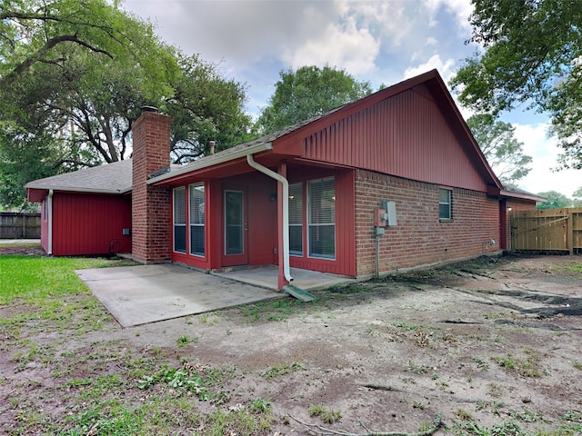 1402 Cherry Springs Ct, Missouri City, TX 77459 - rear view of property with a patio, a chimney, and brick siding