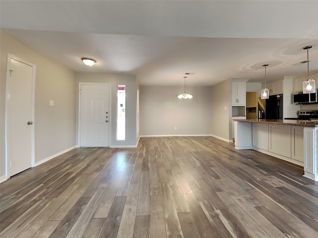 1402 Cherry Springs Ct, Missouri City, TX 77459 - entryway featuring wood finished floors and a chandelier
