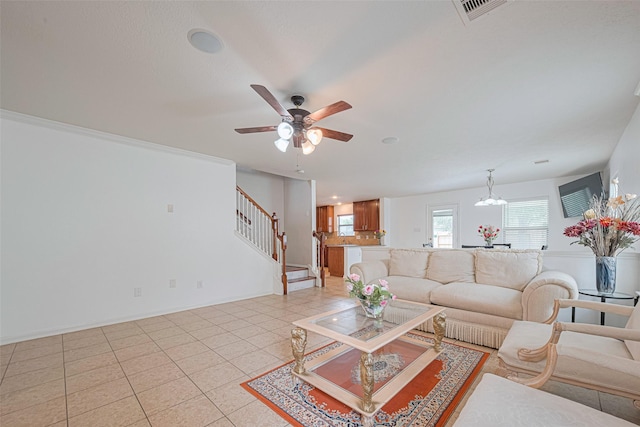 18231 Rexine Ln, Cypress, TX 77433 - living area with stairs, ceiling fan, a chandelier, and light tile patterned floors