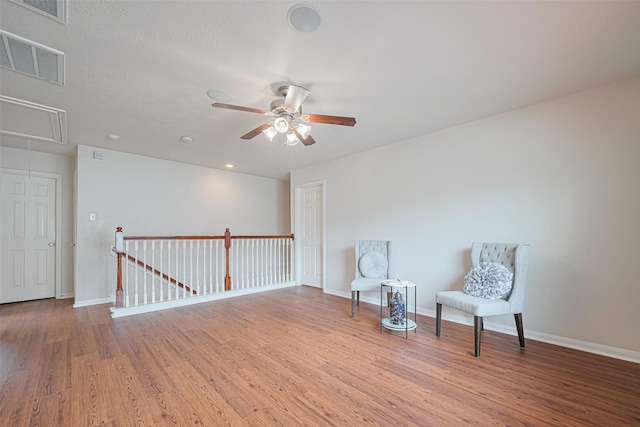 18231 Rexine Ln, Cypress, TX 77433 - unfurnished room with attic access, wood finished floors, a ceiling fan, and an upstairs landing