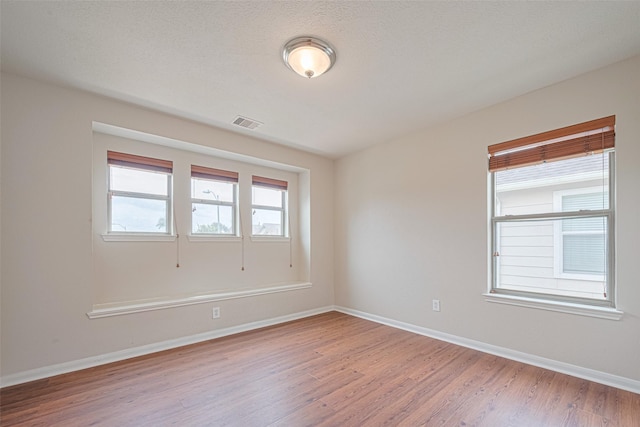 18231 Rexine Ln, Cypress, TX 77433 - empty room with wood finished floors and baseboards