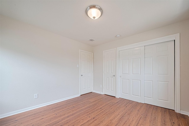 18231 Rexine Ln, Cypress, TX 77433 - unfurnished bedroom featuring light wood-type flooring and a closet