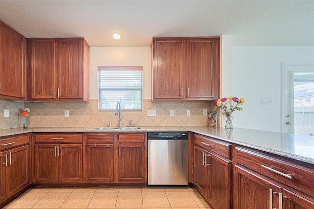 18231 Rexine Ln, Cypress, TX 77433 - kitchen with dishwasher, decorative backsplash, light stone countertops, light tile patterned flooring, and brown cabinetry