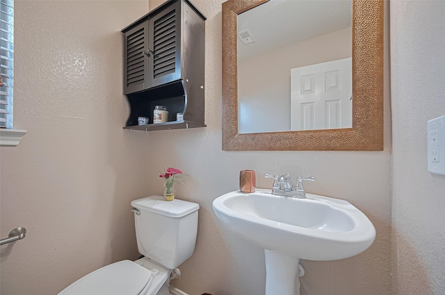 18231 Rexine Ln, Cypress, TX 77433 - half bathroom featuring toilet and a sink