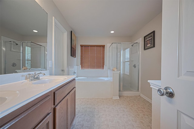 18231 Rexine Ln, Cypress, TX 77433 - full bathroom with a shower stall, a garden tub, double vanity, and recessed lighting