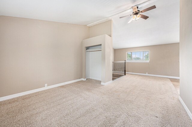 7403 Falcon Dr, Brookshire, TX 77423 - unfurnished bedroom with light colored carpet, lofted ceiling, a closet, and ceiling fan