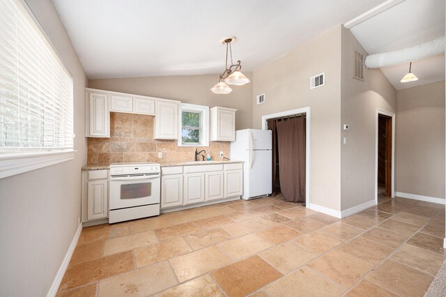 7403 Falcon Dr, Brookshire, TX 77423 - kitchen with white appliances, lofted ceiling, stone tile floors, backsplash, and hanging light fixtures
