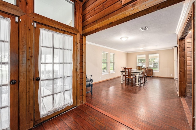 7403 Falcon Dr, Brookshire, TX 77423 - dining area featuring ornamental molding and dark wood finished floors