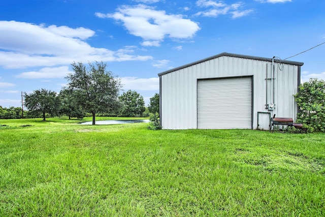 7403 Falcon Dr, Brookshire, TX 77423 - detached garage featuring a water view