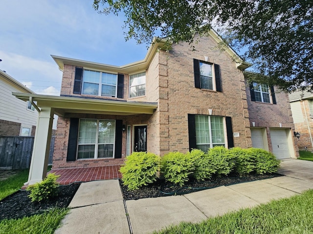 8123 Spring Bluebonnet Dr, Sugar Land, TX 77479 - traditional-style home with brick siding, concrete driveway, and a garage