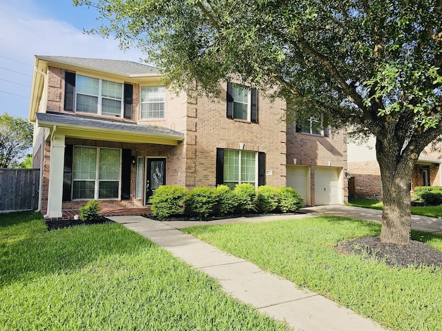 8123 Spring Bluebonnet Dr, Sugar Land, TX 77479 - traditional home featuring an attached garage, brick siding, and concrete driveway