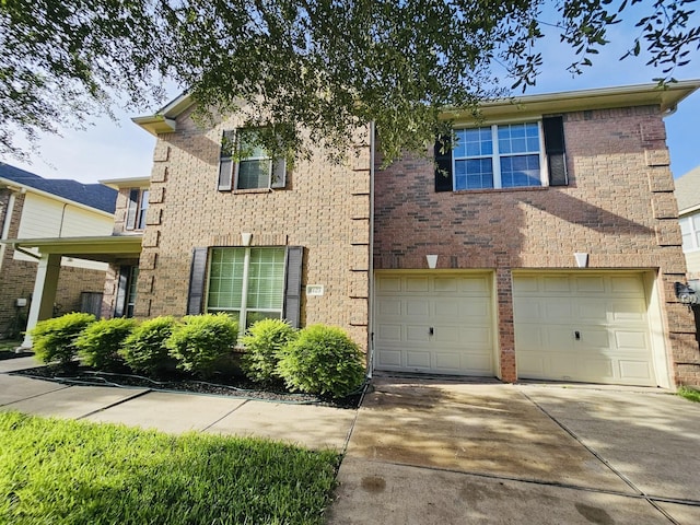 8123 Spring Bluebonnet Dr, Sugar Land, TX 77479 - traditional-style home with a garage, concrete driveway, and brick siding
