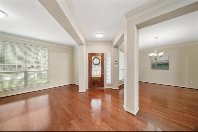 8123 Spring Bluebonnet Dr, Sugar Land, TX 77479 - entrance foyer with wood finished floors, a chandelier, and crown molding