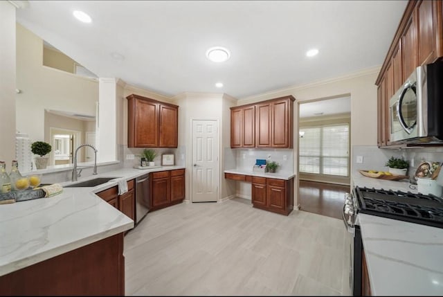 8123 Spring Bluebonnet Dr, Sugar Land, TX 77479 - kitchen featuring appliances with stainless steel finishes, ornamental molding, tasteful backsplash, light stone countertops, and recessed lighting