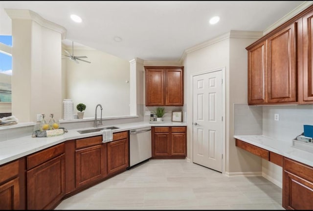 8123 Spring Bluebonnet Dr, Sugar Land, TX 77479 - kitchen with stainless steel dishwasher, ceiling fan, tasteful backsplash, light countertops, and built in desk