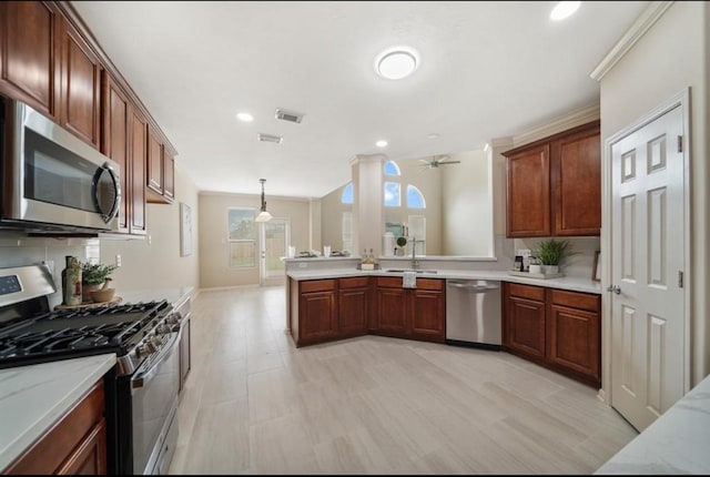 8123 Spring Bluebonnet Dr, Sugar Land, TX 77479 - kitchen featuring stainless steel appliances, a peninsula, ceiling fan, tasteful backsplash, and hanging light fixtures