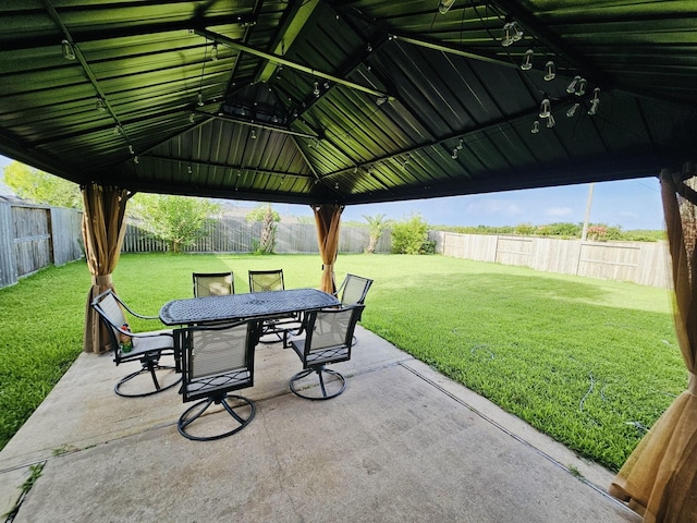 8123 Spring Bluebonnet Dr, Sugar Land, TX 77479 - fenced backyard featuring a patio, outdoor dining area, and a gazebo