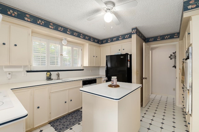 1311 Linwood Dr, Wharton, TX 77488 - kitchen with freestanding refrigerator, light flooring, light countertops, a ceiling fan, and a textured ceiling