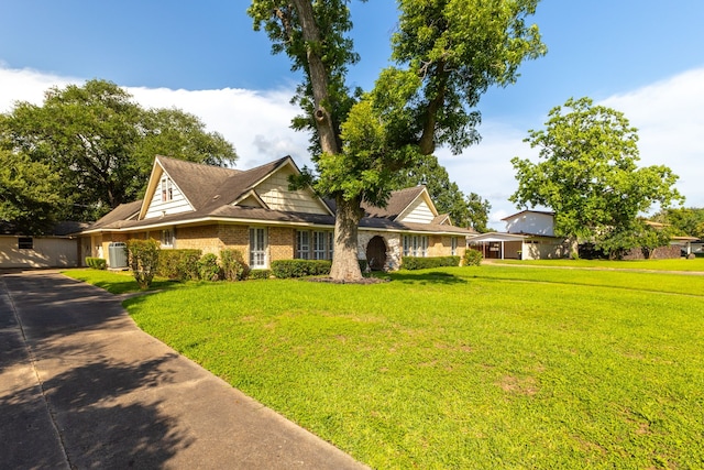 1311 Linwood Dr, Wharton, TX 77488 - traditional home featuring a front yard, brick siding, and driveway