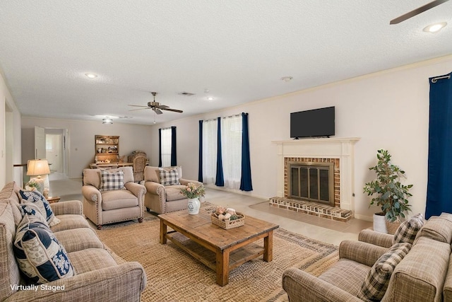 1311 Linwood Dr, Wharton, TX 77488 - living room featuring a ceiling fan, a textured ceiling, a brick fireplace, recessed lighting, and ornamental molding