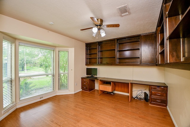 11103 Pembridge Dr, Houston, TX 77071 - unfurnished office with built in desk, light wood-type flooring, and a ceiling fan