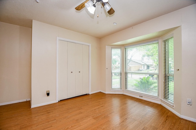 11103 Pembridge Dr, Houston, TX 77071 - unfurnished bedroom featuring light wood-style flooring, a closet, and a ceiling fan