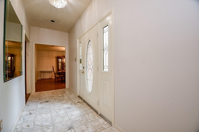 11103 Pembridge Dr, Houston, TX 77071 - foyer with light marble finish flooring and a chandelier